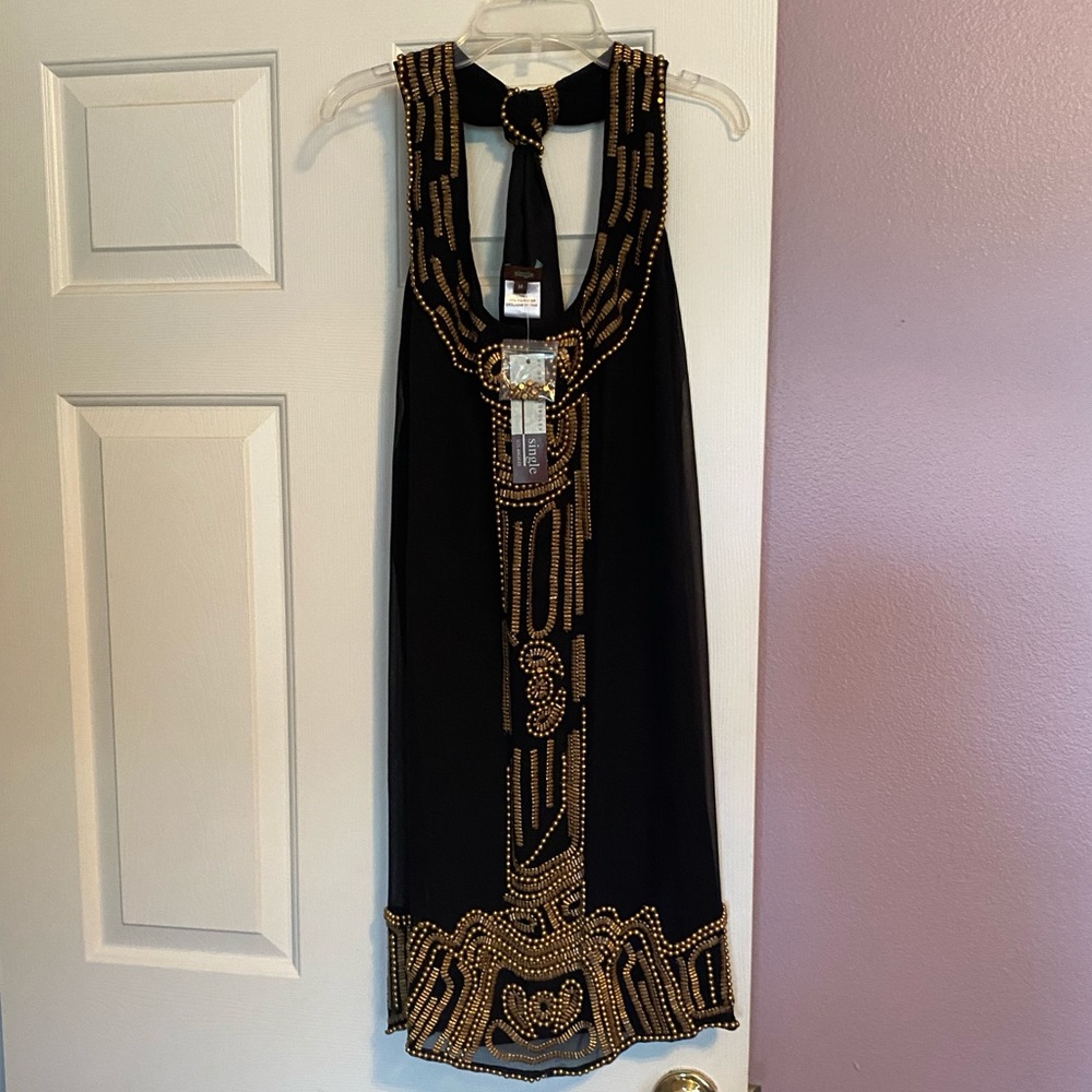 Single brand,  never been worn, size 8 beaded dress.